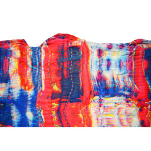 A Tight Shot Of A Vibrant Blue And Red Textile. It Has Embroidered And Beaded Embellishments.