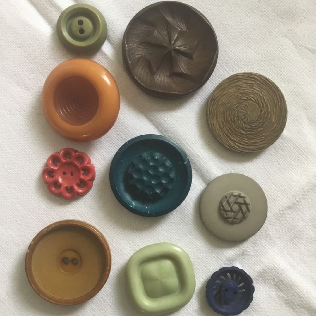 An eclectic collection of a colourful buttons.